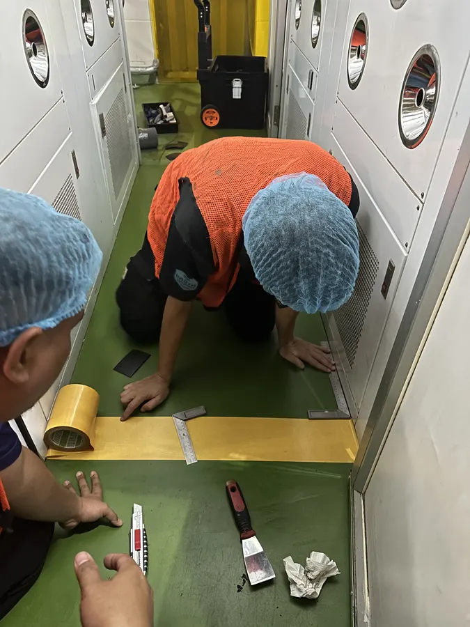 SGH technician installing contamination control matting